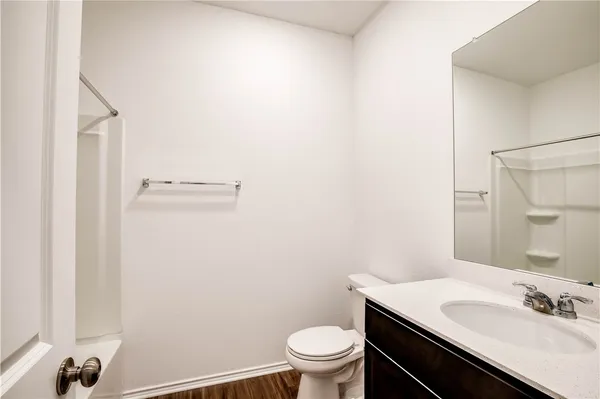 a bathroom with a sink toilet and a mirror