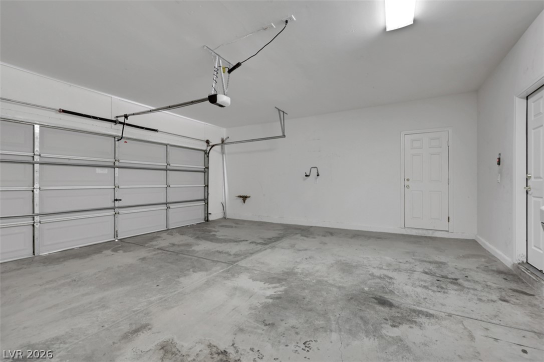 10328 Hawk Ravine Street Las Vegas, NV 89178 - Photo 18 of 55 A spacious, pristine garage offers ample room for vehicles and storage.