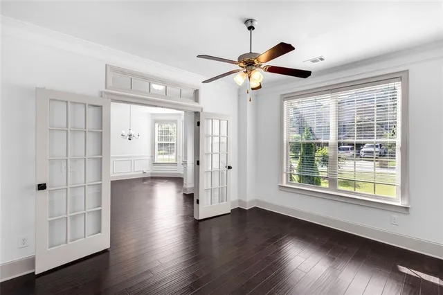 a living room with furniture a fireplace and a chandelier