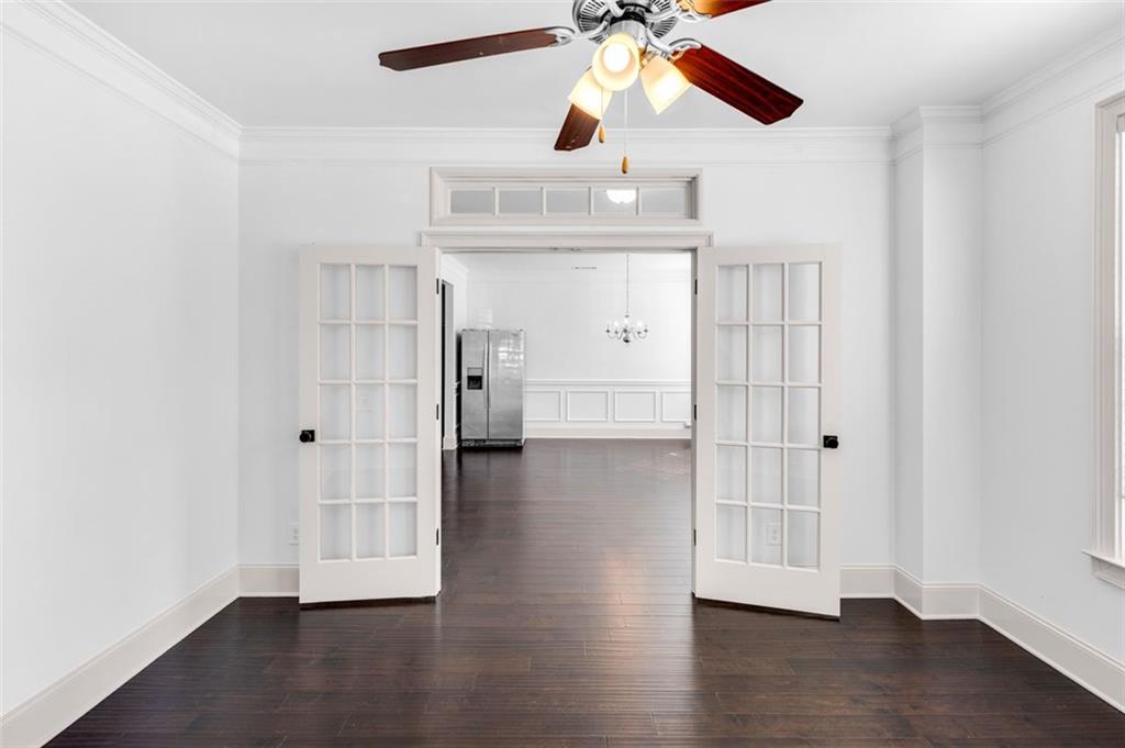 908 Rainsong Court Braselton, GA 30517 - Photo 16 of 79 a view of empty room with wooden floor