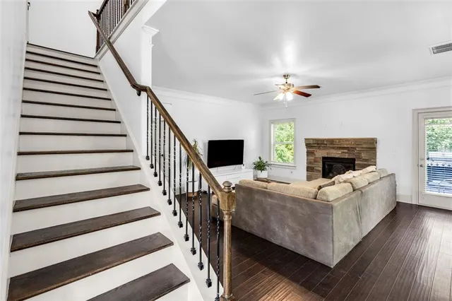 a kitchen with stainless steel appliances granite countertop a refrigerator sink and stove