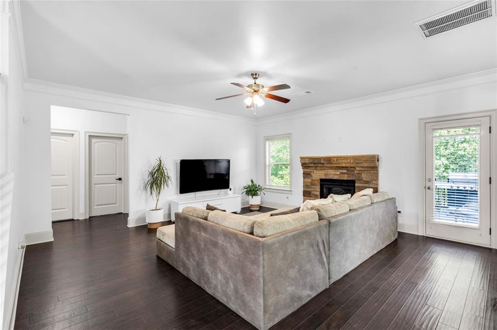 908 Rainsong Court Braselton, GA 30517 - Photo 19 of 79 a living room with furniture fireplace and a flat screen tv