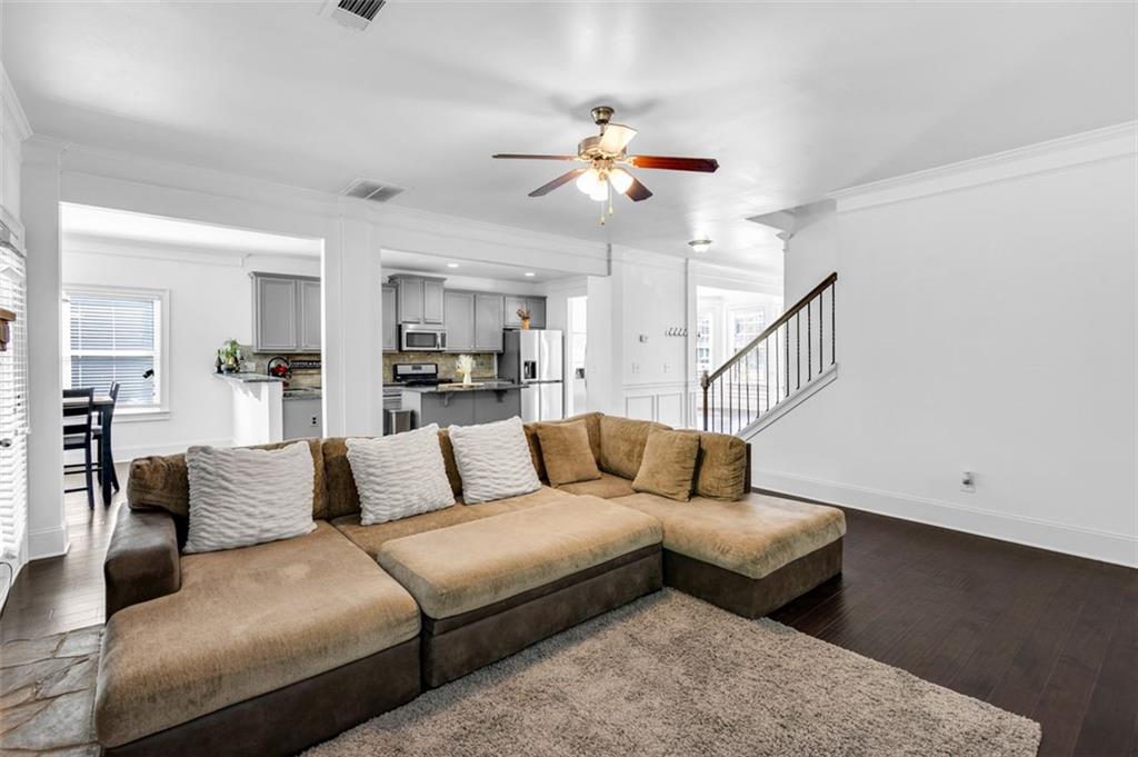 908 Rainsong Court Braselton, GA 30517 - Photo 21 of 79 a living room with furniture and a view of kitchen