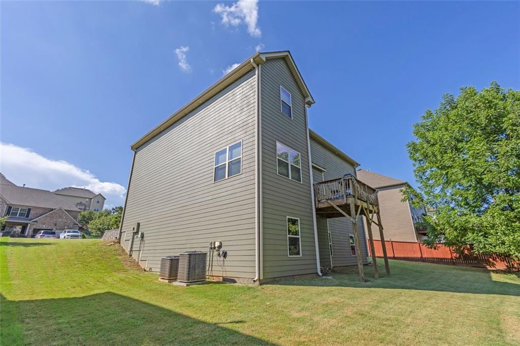 908 Rainsong Court Braselton, GA 30517 - Photo 3 of 79 a view of a house with a yard