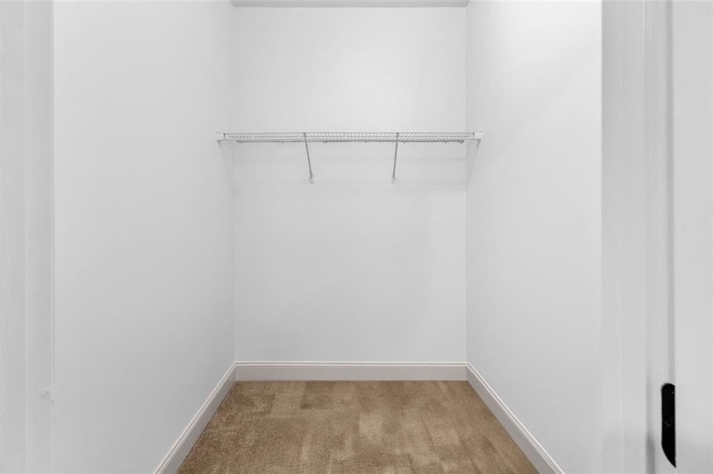 908 Rainsong Court Braselton, GA 30517 - Photo 33 of 79 a view of a room with racks on the wall