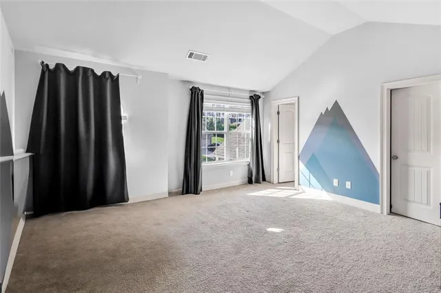 a view of an empty room with a sliding door