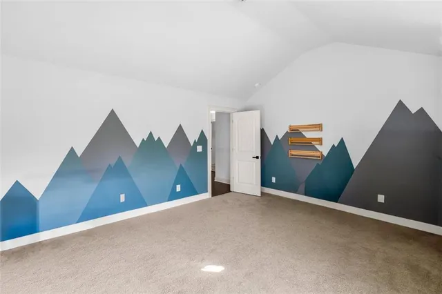 an aerial view of multiple houses with a yard