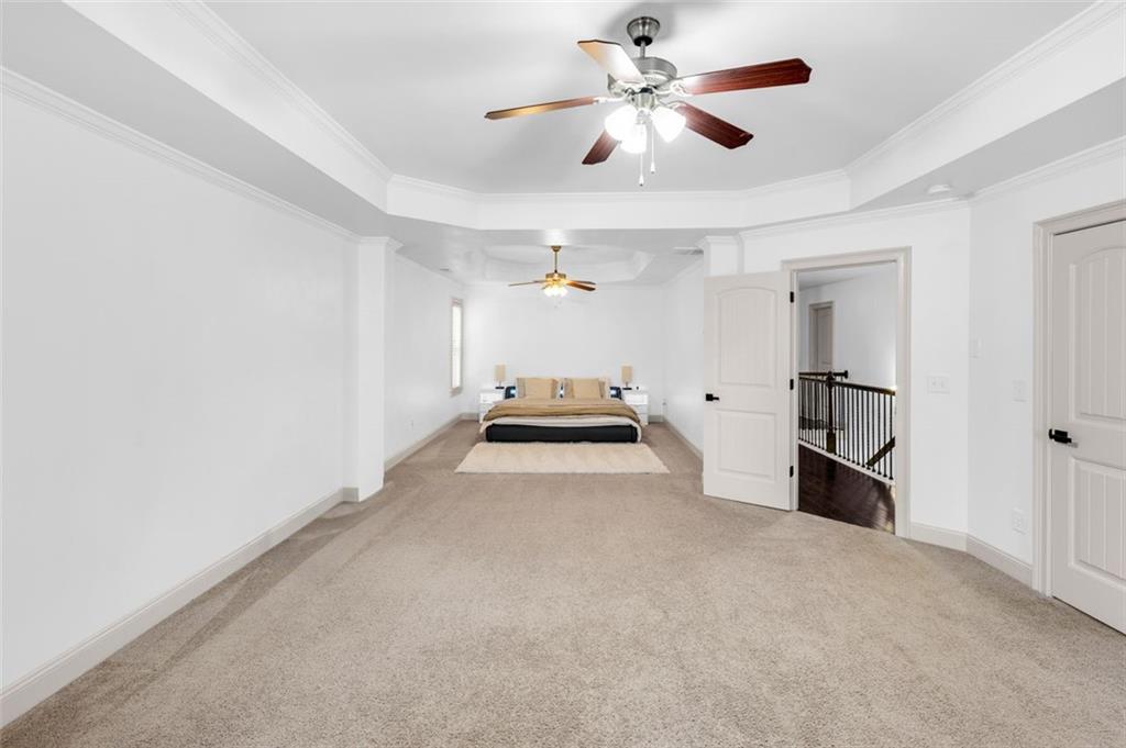908 Rainsong Court Braselton, GA 30517 - Photo 52 of 79 a view of a livingroom with a ceiling fan and a ceiling fan