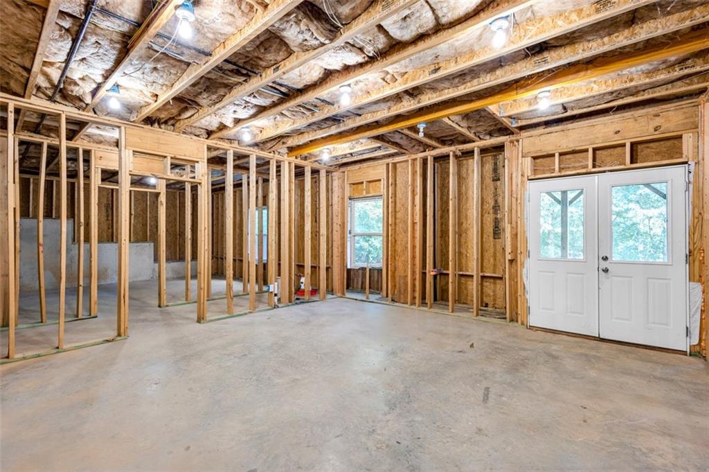 908 Rainsong Court Braselton, GA 30517 - Photo 68 of 79 a view of an empty room with a sliding door