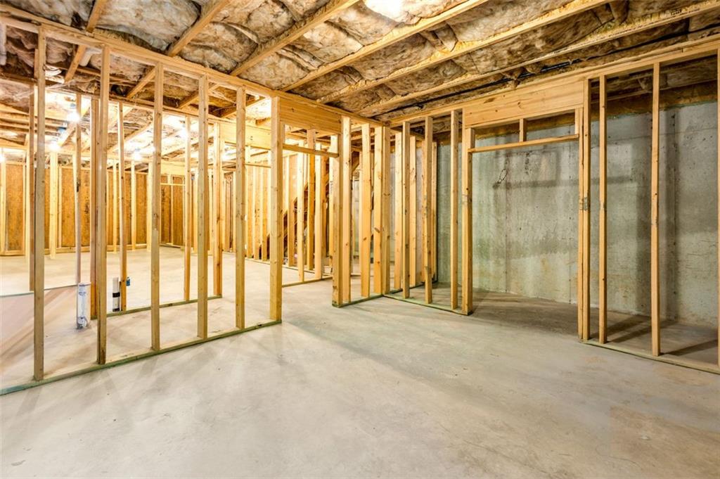 908 Rainsong Court Braselton, GA 30517 - Photo 73 of 79 a view of an empty room with a sliding door