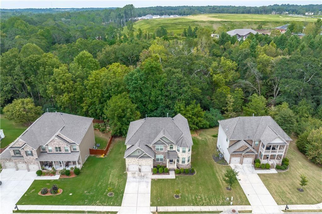 908 Rainsong Court Braselton, GA 30517 - Photo 76 of 79 an aerial view of multiple houses with a yard