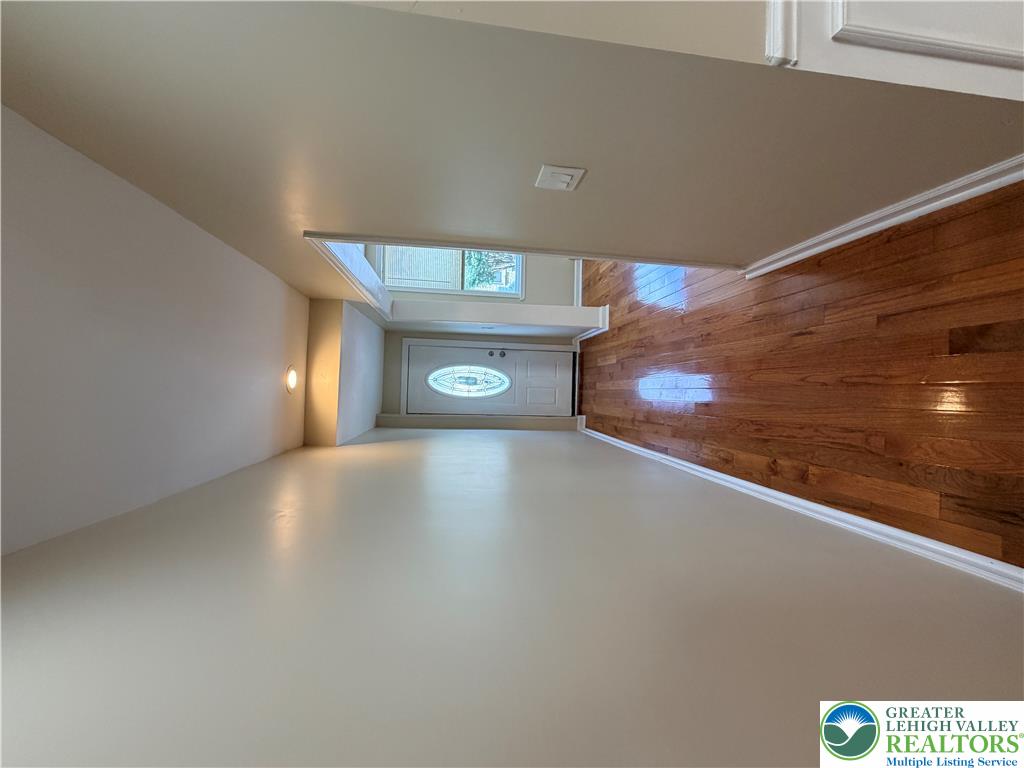 718 Ferry Street Easton, PA 18042 - Photo 36 of 37 A grand entrance welcomes you with a decorative door and gleaming wood flooring.