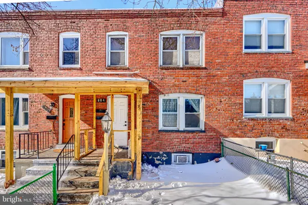 a front view of a brick building with many windows