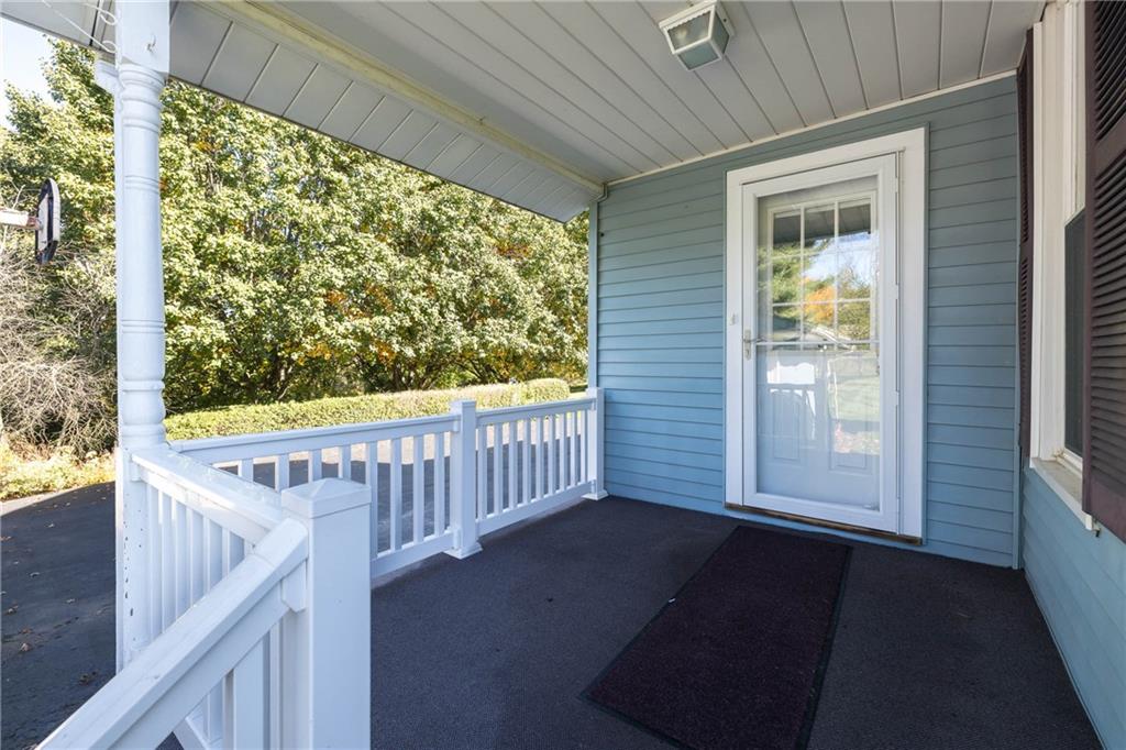 1741 Ridgewood Drive Washington, PA 15301 - Photo 17 of 45 8'10" X 7'8" COVERED BACK PORCH WITH ENTRY TO THE LAUNDRY ROOM - EASILY ACCESSIBLE FROM THE GARAGE.