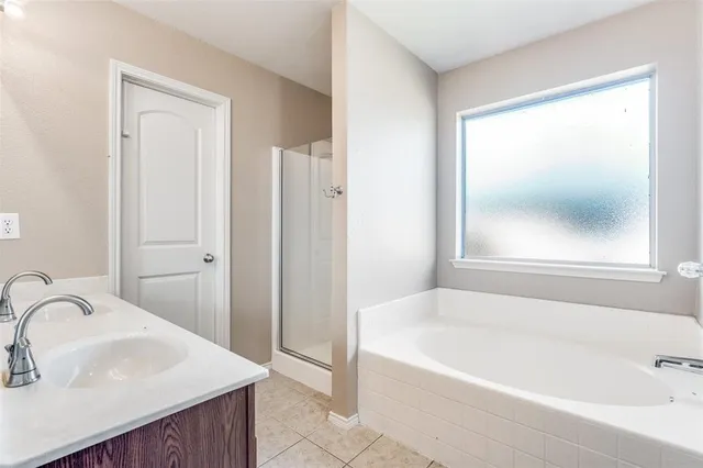 a bathroom with a bathtub and a sink