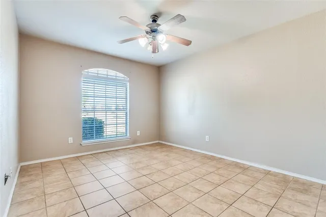 a view of an empty room with windows