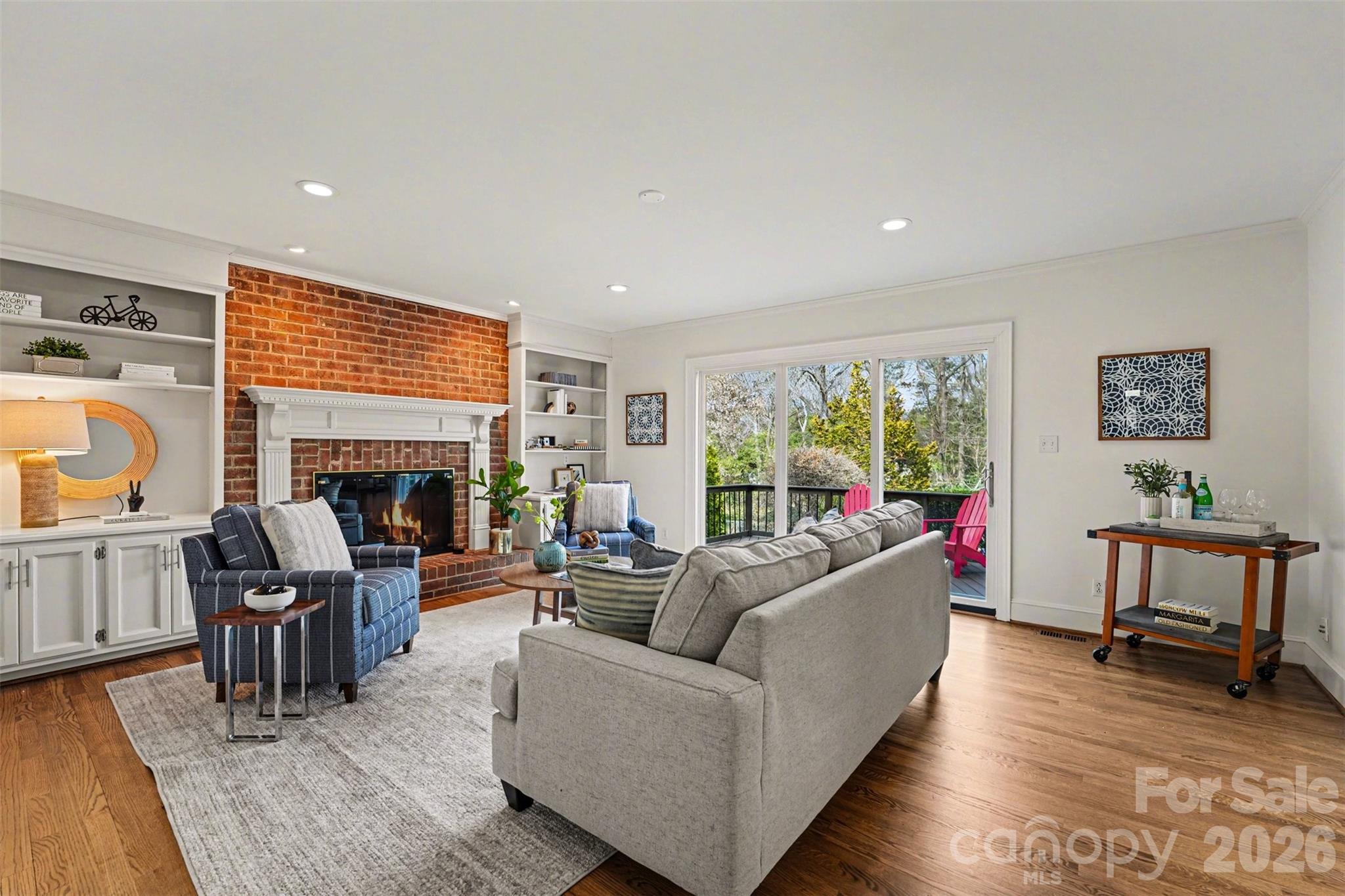 5606 Hillingdon Road Charlotte, NC 28226 - Photo 13 of 41 a living room with furniture and a fireplace