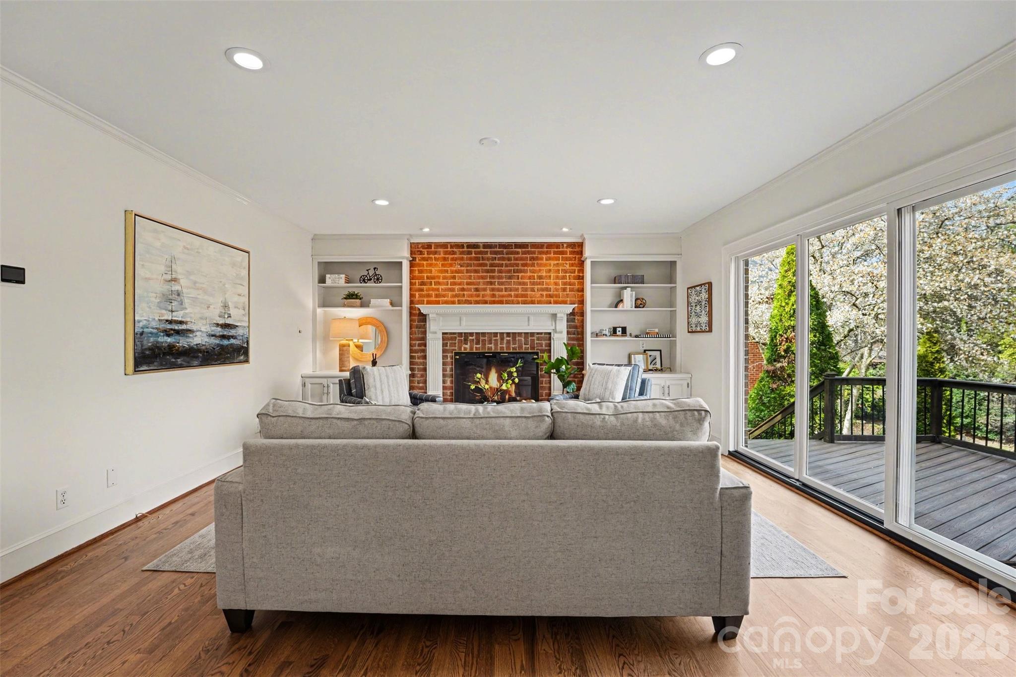 5606 Hillingdon Road Charlotte, NC 28226 - Photo 14 of 41 a living room with fireplace furniture and a large window