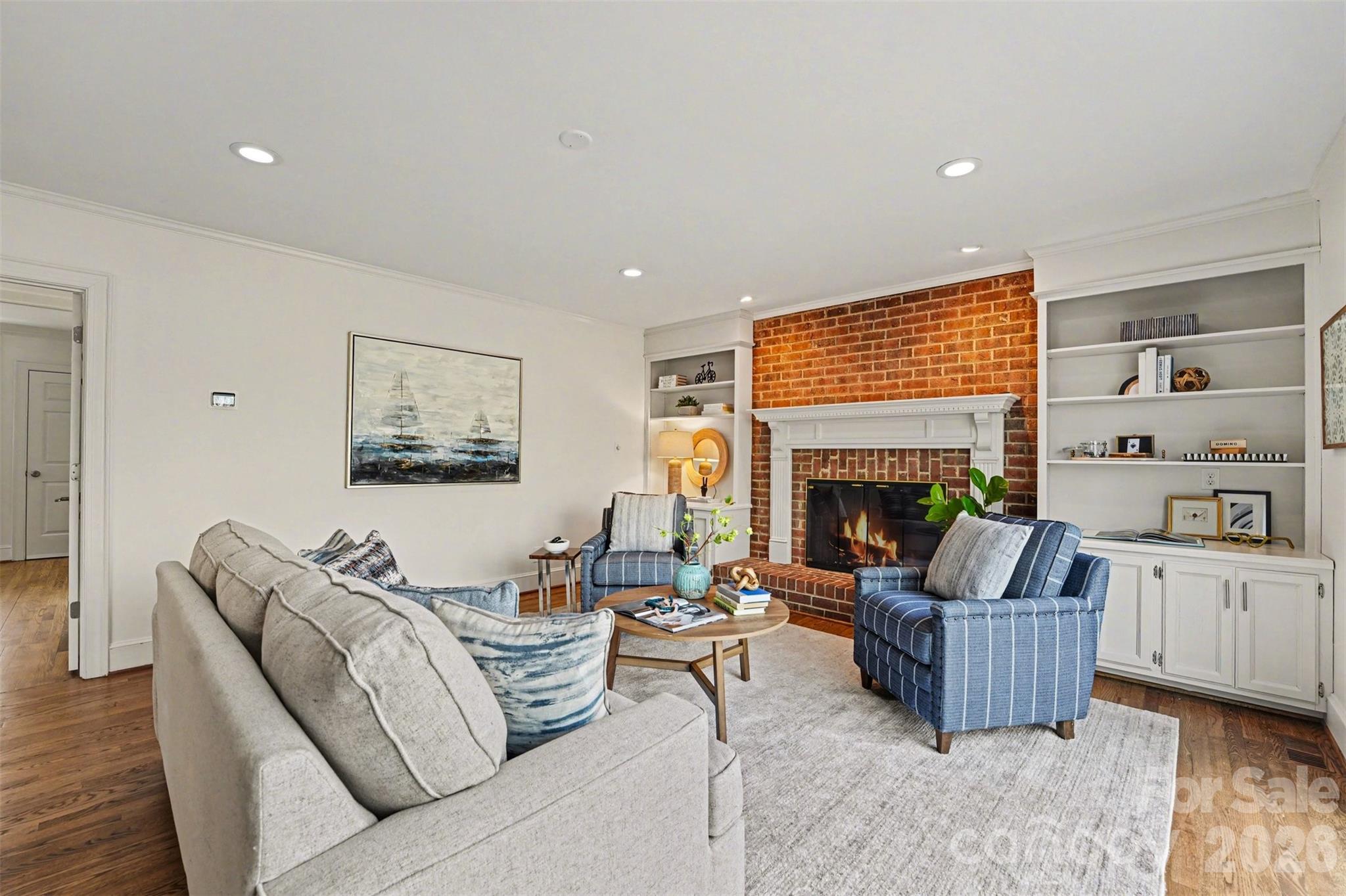 5606 Hillingdon Road Charlotte, NC 28226 - Photo 15 of 41 a living room with furniture and a fireplace