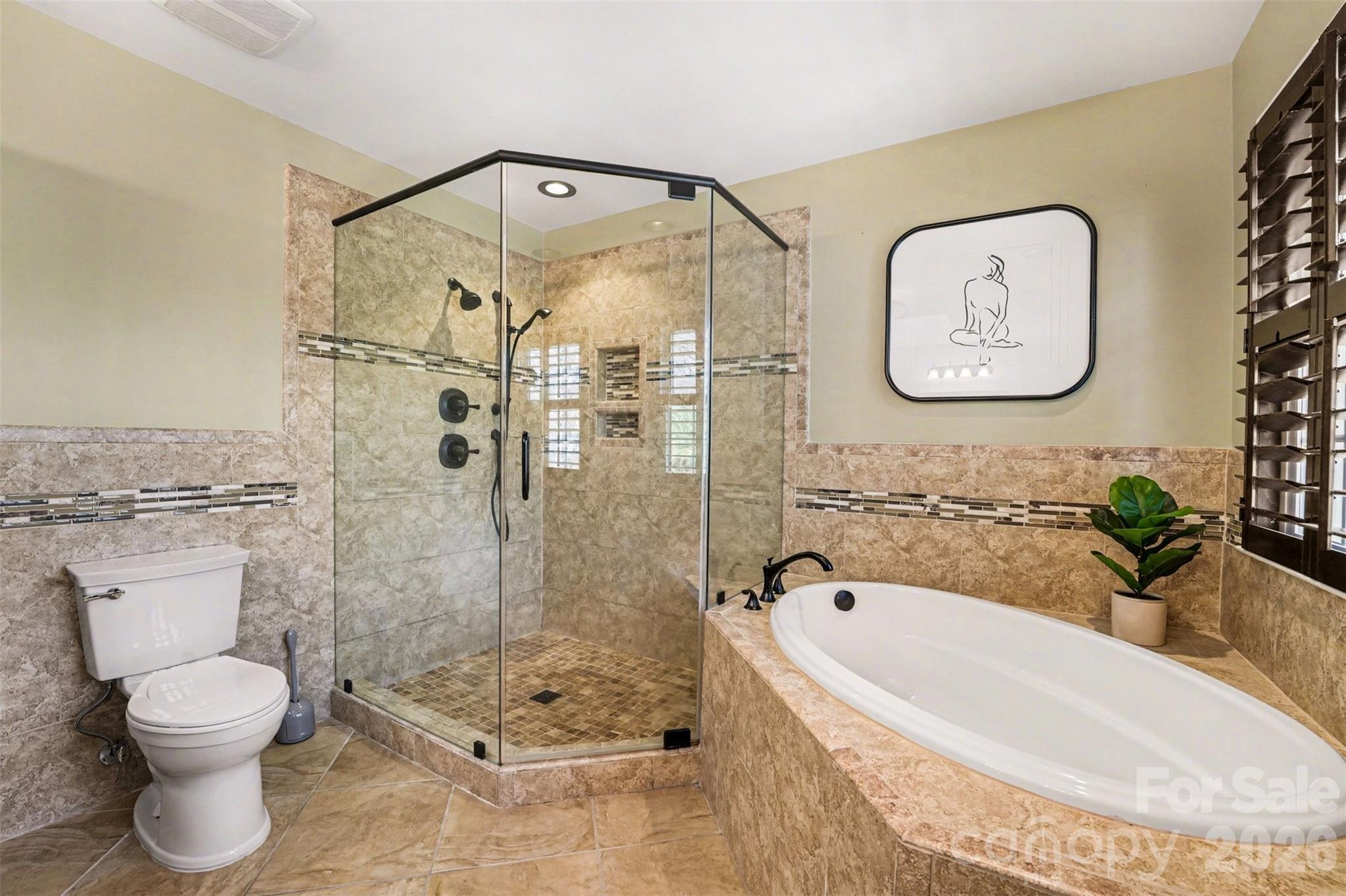 5606 Hillingdon Road Charlotte, NC 28226 - Photo 18 of 41 a bathroom with a tub and toilet
