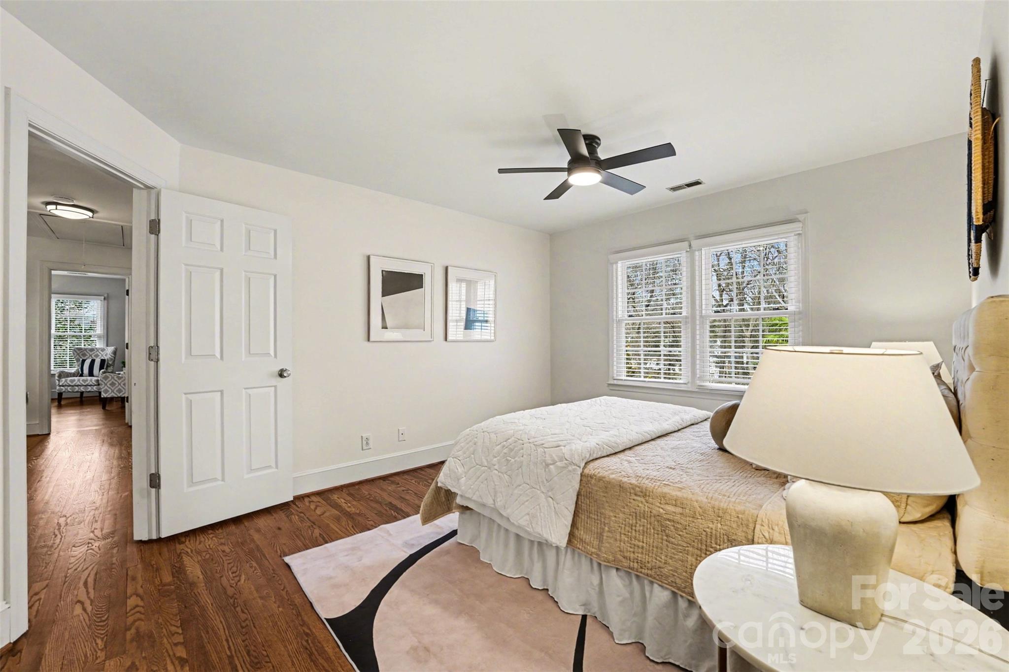 5606 Hillingdon Road Charlotte, NC 28226 - Photo 23 of 41 a bedroom with a bed and wooden floor