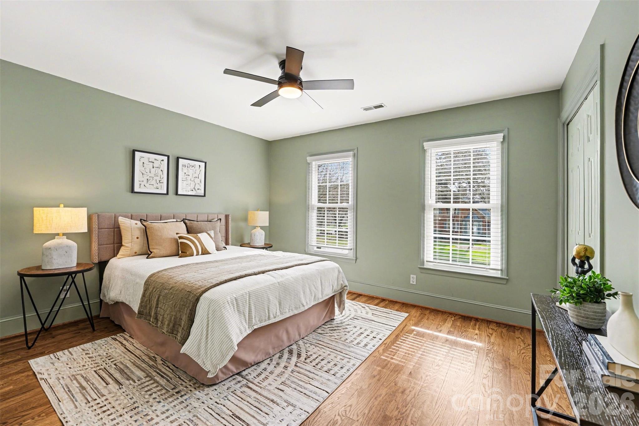 5606 Hillingdon Road Charlotte, NC 28226 - Photo 25 of 41 a spacious bedroom with a large bed and a window