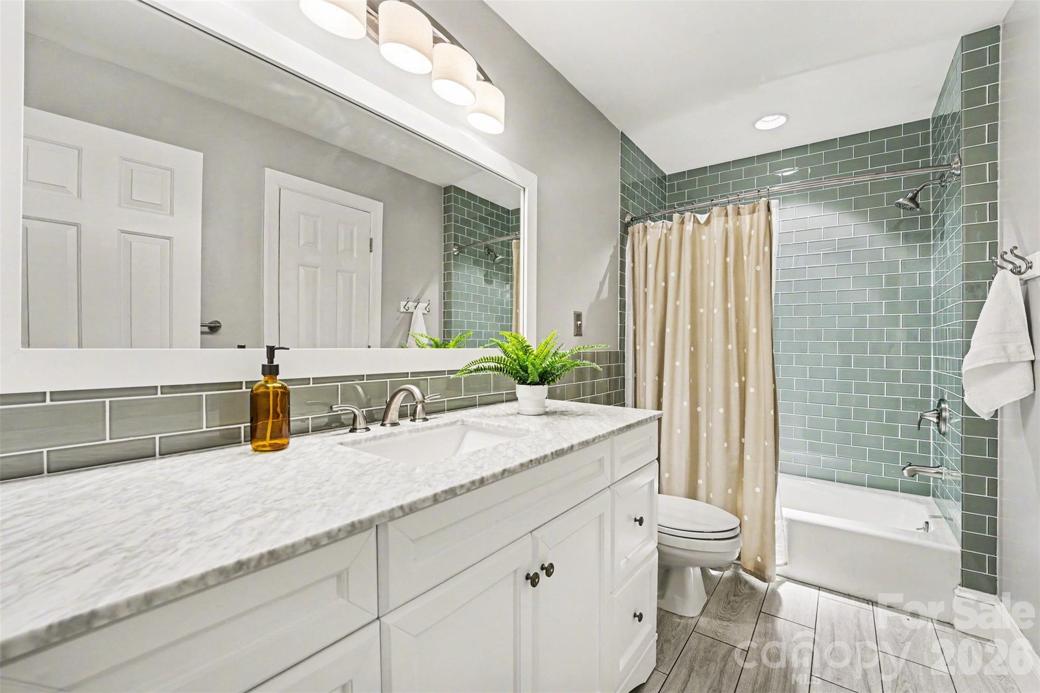 5606 Hillingdon Road Charlotte, NC 28226 - Photo 27 of 41 a bathroom with a granite countertop sink and a mirror