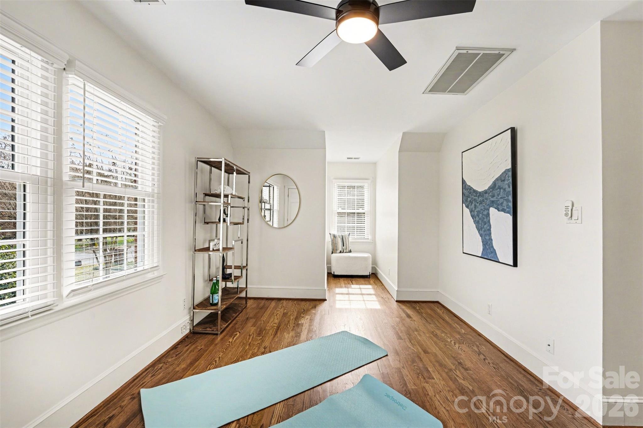 5606 Hillingdon Road Charlotte, NC 28226 - Photo 31 of 41 a view of an empty room with a window and wooden floor