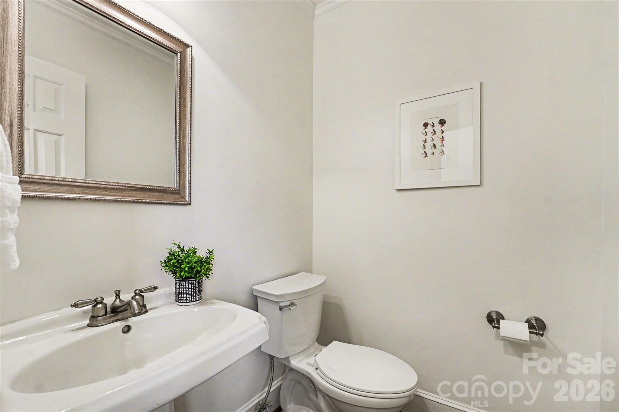 5606 Hillingdon Road Charlotte, NC 28226 - Photo 39 of 41 a bathroom with a sink mirror and toilet