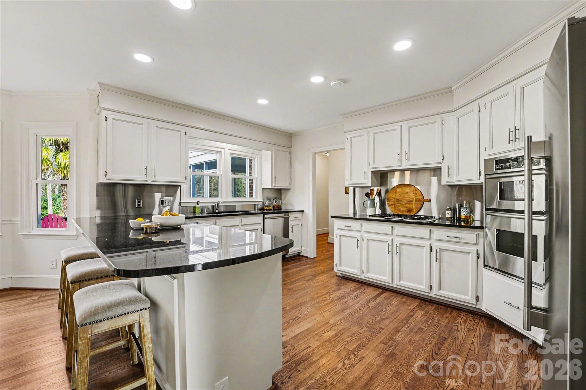 5606 Hillingdon Road Charlotte, NC 28226 - Photo 8 of 41 a kitchen with counter top space cabinets and stainless steel appliances