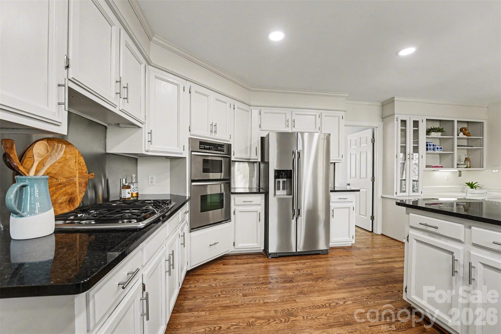 5606 Hillingdon Road Charlotte, NC 28226 - Photo 9 of 41 a kitchen with stainless steel appliances granite countertop a stove and a refrigerator