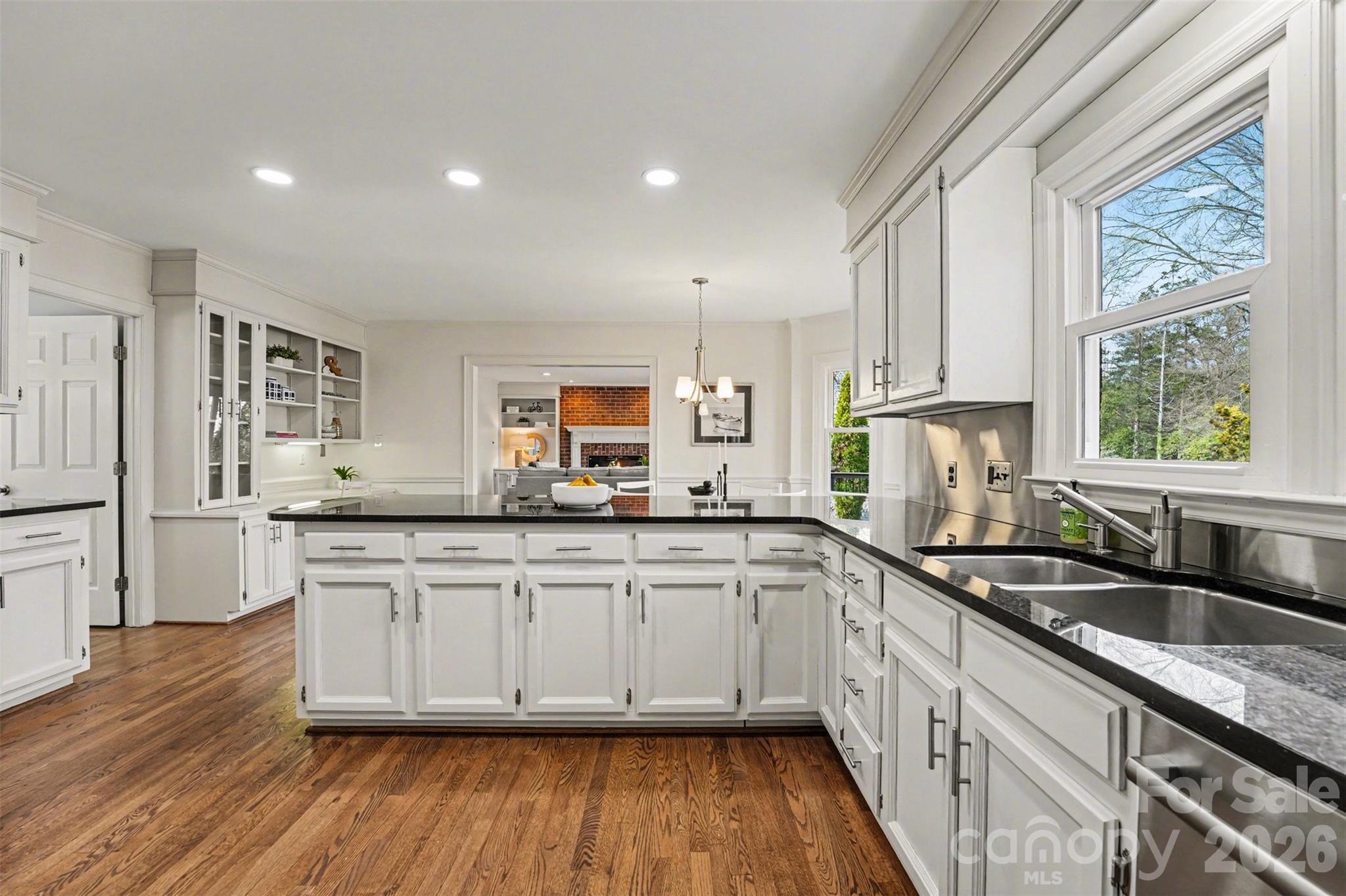 5606 Hillingdon Road Charlotte, NC 28226 - Photo 10 of 41 a kitchen with granite countertop a sink and cabinets