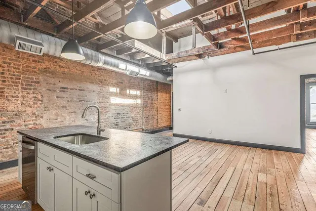 a kitchen with a sink and cabinets