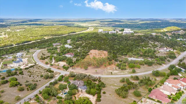 a kitchen with stainless steel appliances granite countertop a stove a sink dishwasher and a refrigerator