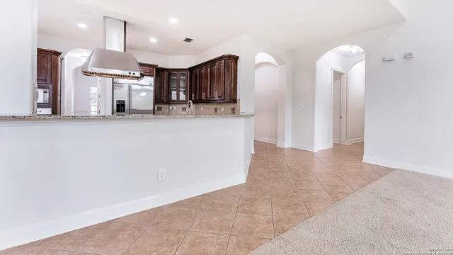 a open kitchen with cabinets and stainless steel appliances