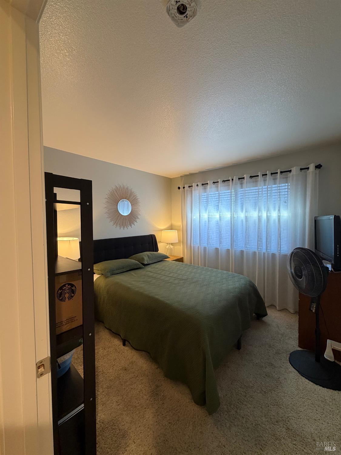 2015 Jackrabbit Court Santa Rosa, CA 95403 - Photo 11 of 20 a bedroom with a bed and a chandelier