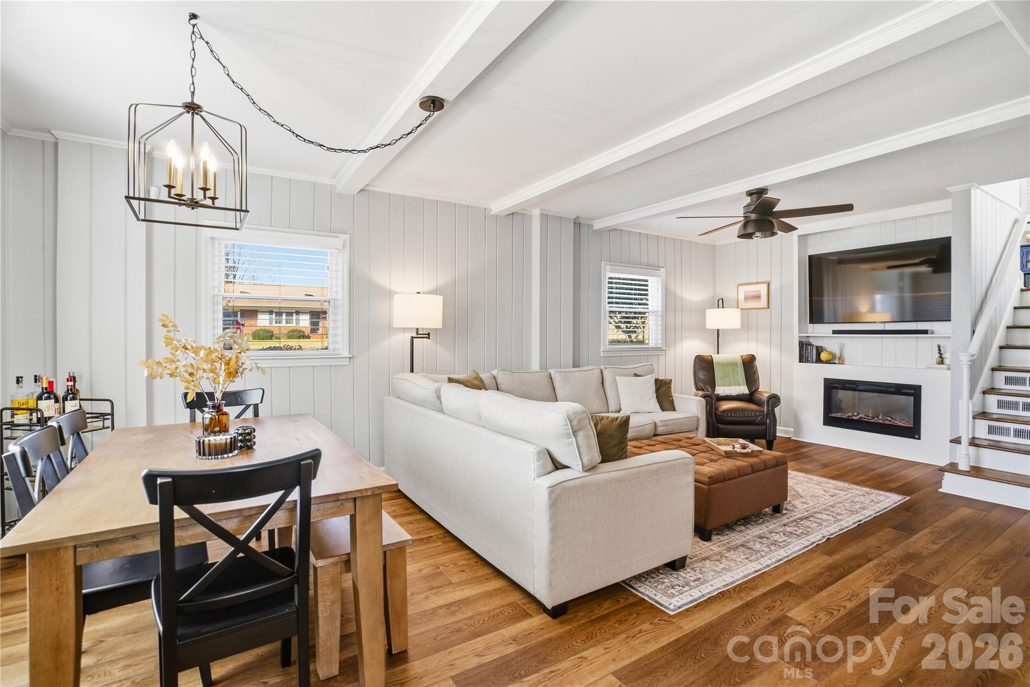 6409 Montpelier Road Charlotte, NC 28210 - Photo 11 of 46 a living room with furniture a fireplace and a flat screen tv