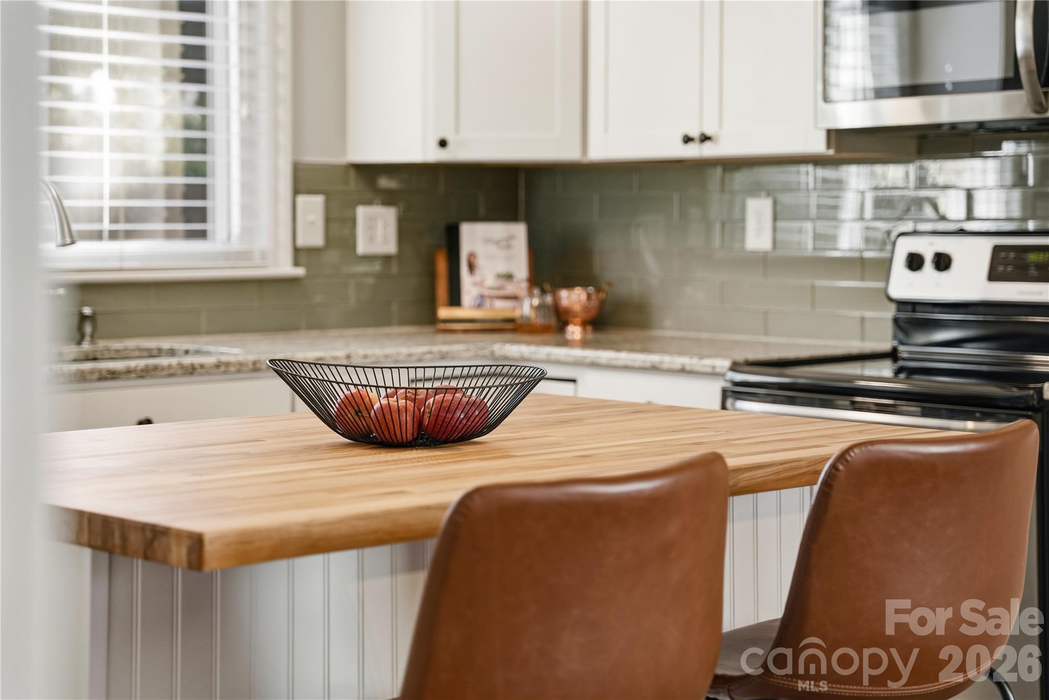 6409 Montpelier Road Charlotte, NC 28210 - Photo 16 of 46 a kitchen with a stove and a sink