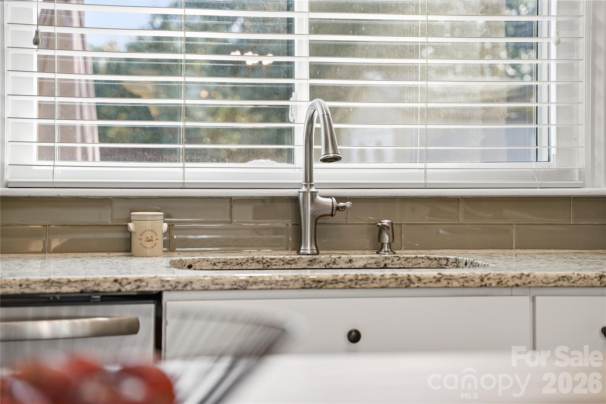 6409 Montpelier Road Charlotte, NC 28210 - Photo 17 of 46 a closeup of a sink and a granite counter top