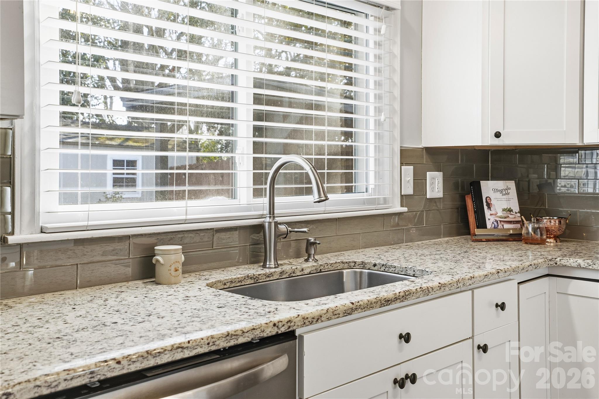 6409 Montpelier Road Charlotte, NC 28210 - Photo 20 of 46 a kitchen with granite countertop a sink and a window