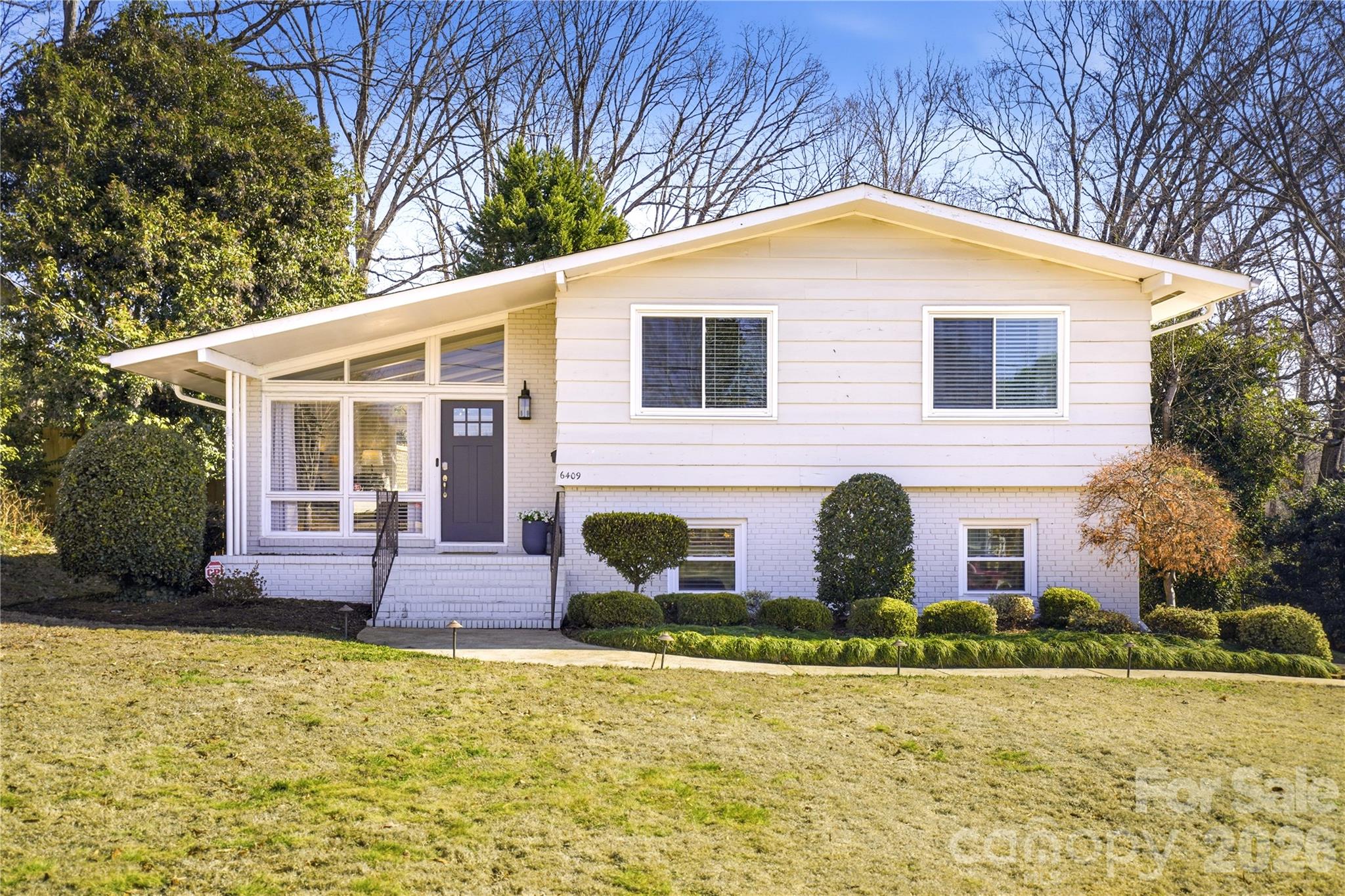 6409 Montpelier Road Charlotte, NC 28210 - Photo 2 of 46 front view of house with a yard