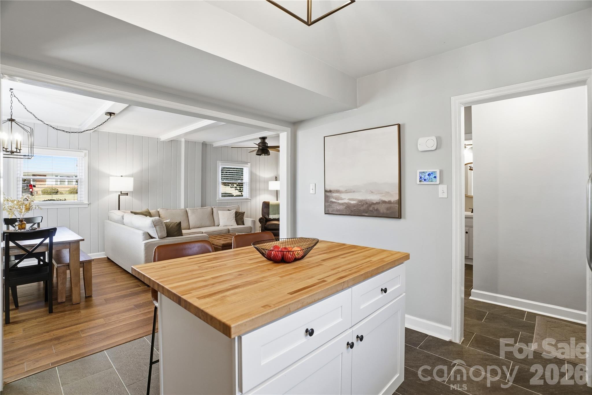 6409 Montpelier Road Charlotte, NC 28210 - Photo 23 of 46 a view of kitchen island with furniture and wooden floor