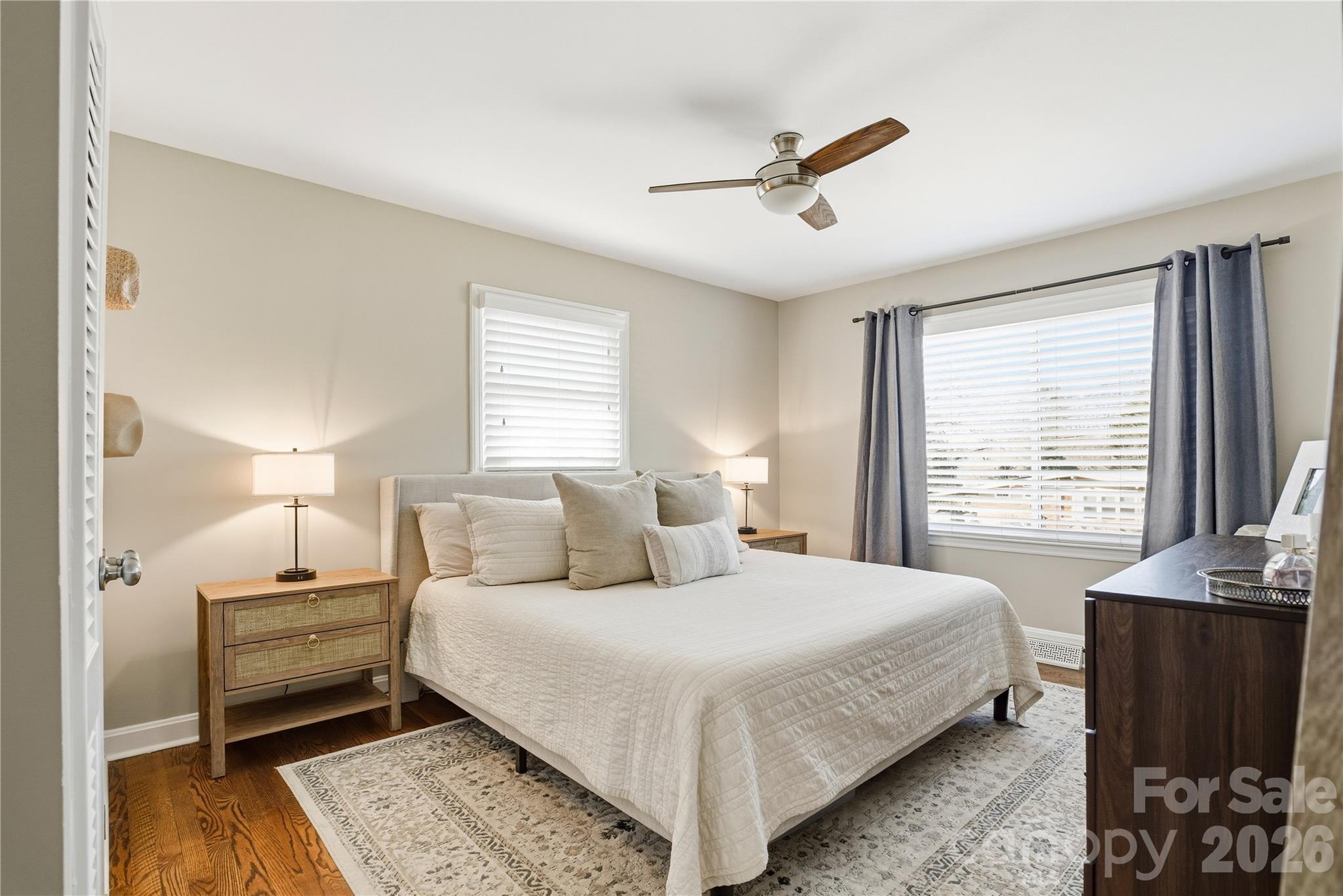 6409 Montpelier Road Charlotte, NC 28210 - Photo 28 of 46 a bedroom with a bed and wooden floor