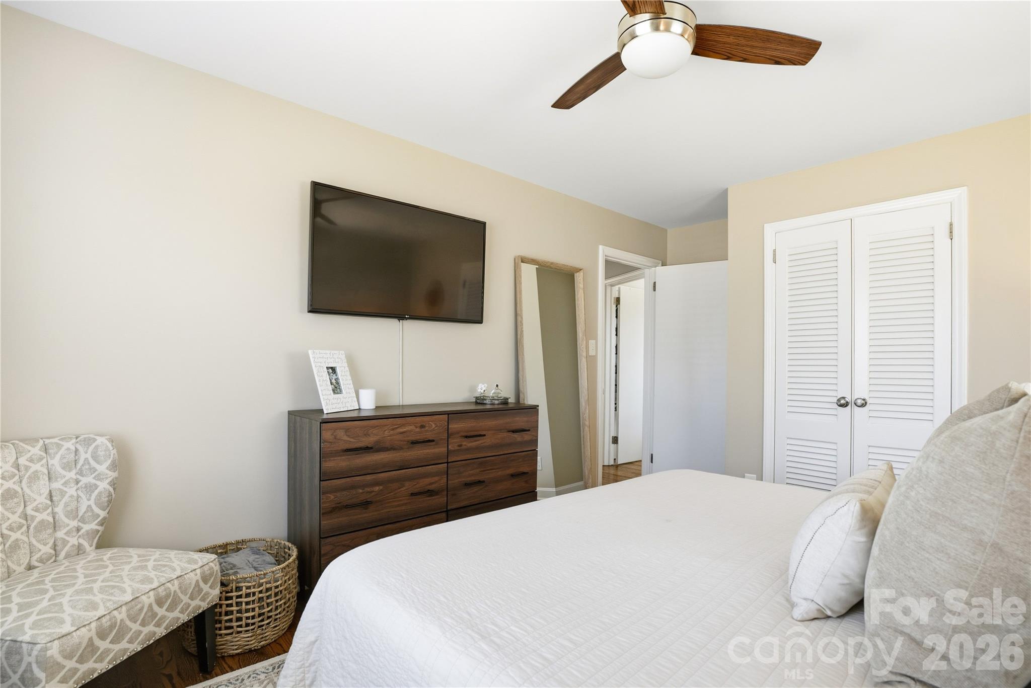 6409 Montpelier Road Charlotte, NC 28210 - Photo 29 of 46 a bedroom with a bed and a flat screen tv