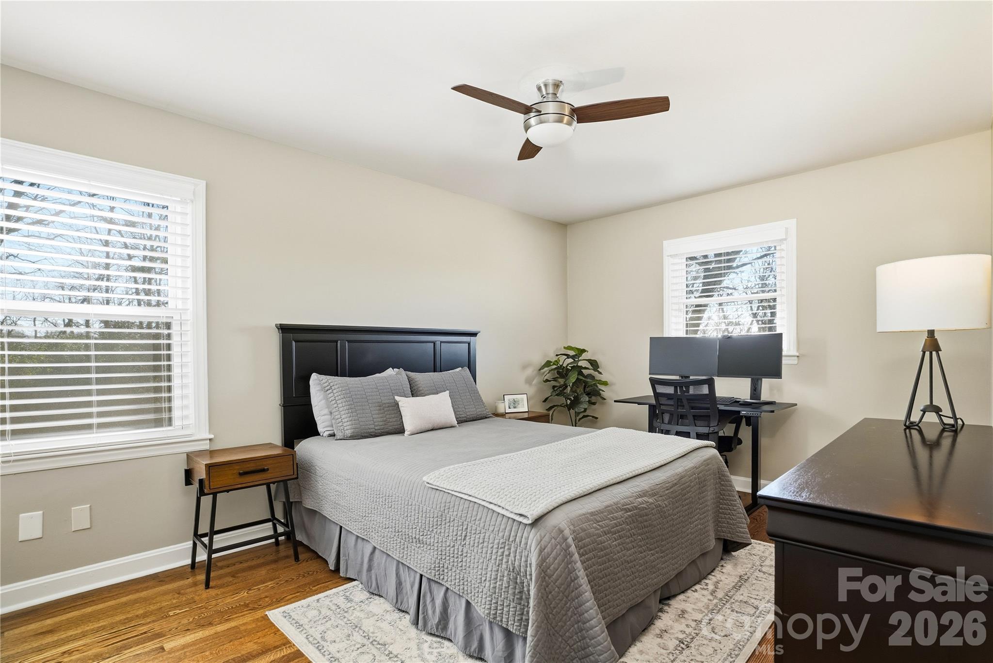 6409 Montpelier Road Charlotte, NC 28210 - Photo 30 of 46 a bedroom with a bed a lamp and a window