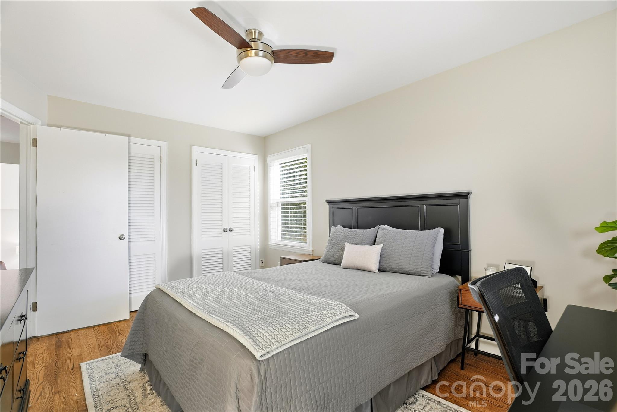6409 Montpelier Road Charlotte, NC 28210 - Photo 31 of 46 a bedroom with a bed and wooden floor