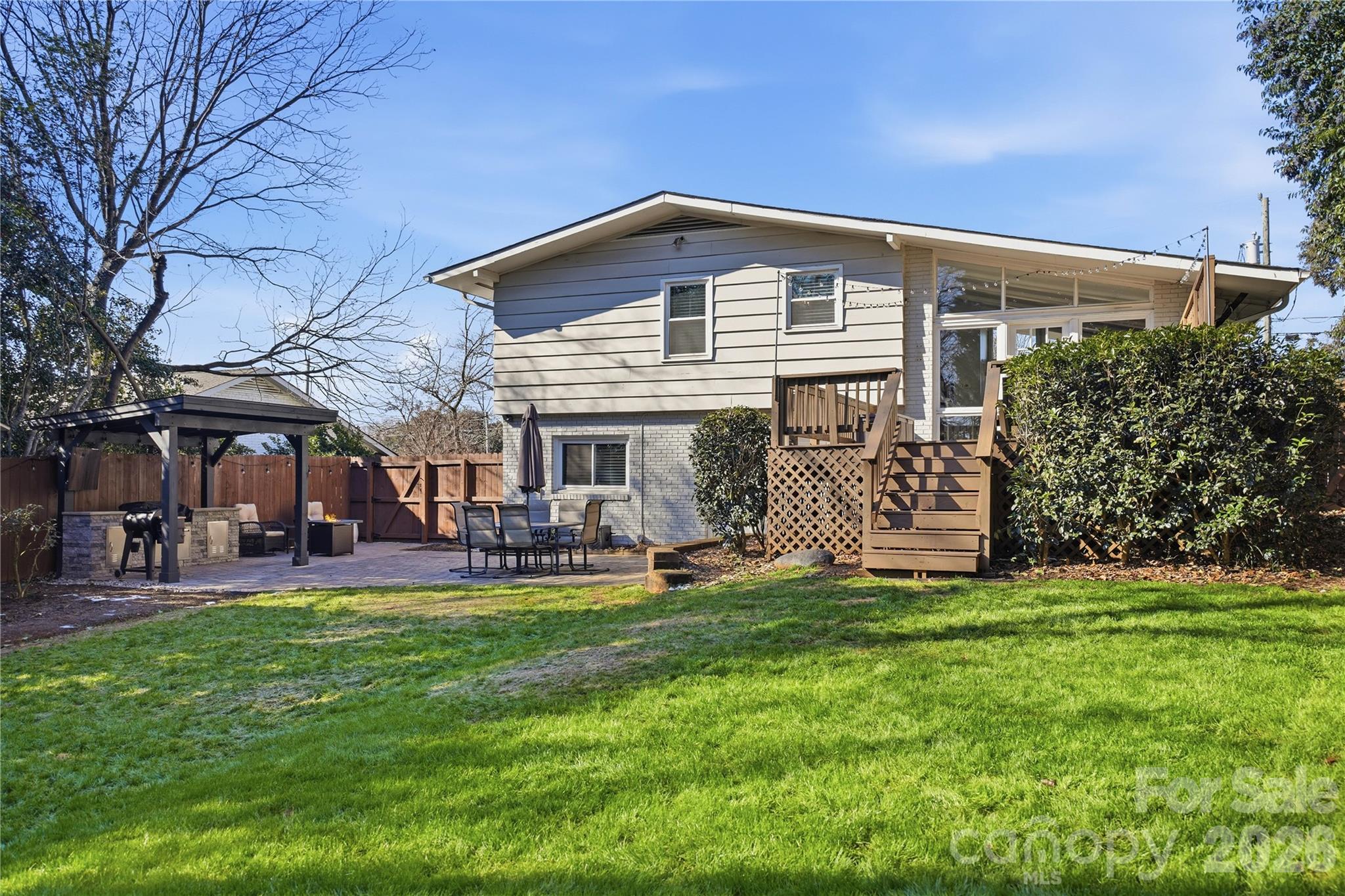 6409 Montpelier Road Charlotte, NC 28210 - Photo 35 of 46 a front view of a house with a garden