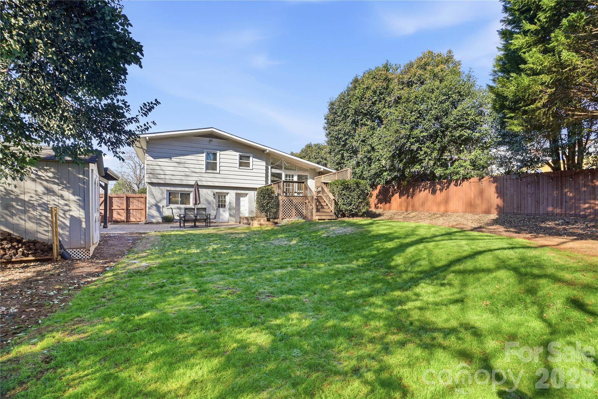 6409 Montpelier Road Charlotte, NC 28210 - Photo 43 of 46 a front view of a house with a garden