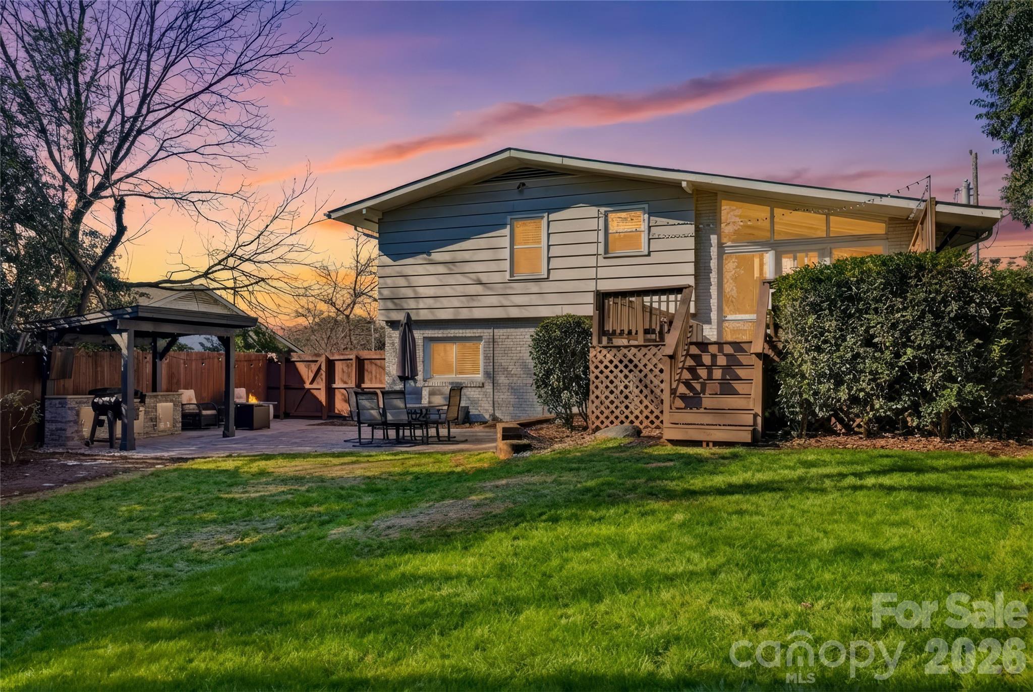 6409 Montpelier Road Charlotte, NC 28210 - Photo 44 of 46 a front view of a house with a garden