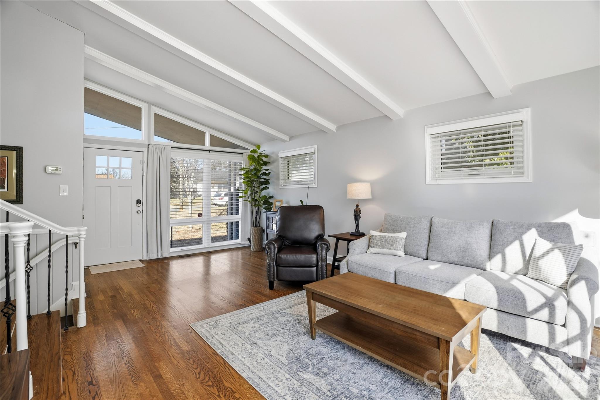 6409 Montpelier Road Charlotte, NC 28210 - Photo 5 of 46 a living room with furniture rug and wooden floor